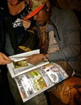 Popcaan checkin out Jugglerz Ad in Riddim Mag